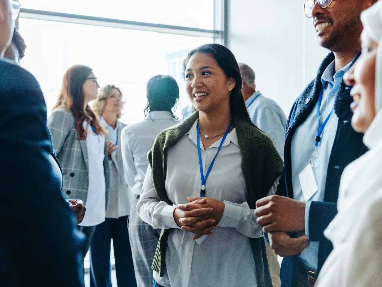 people networking at a conference
