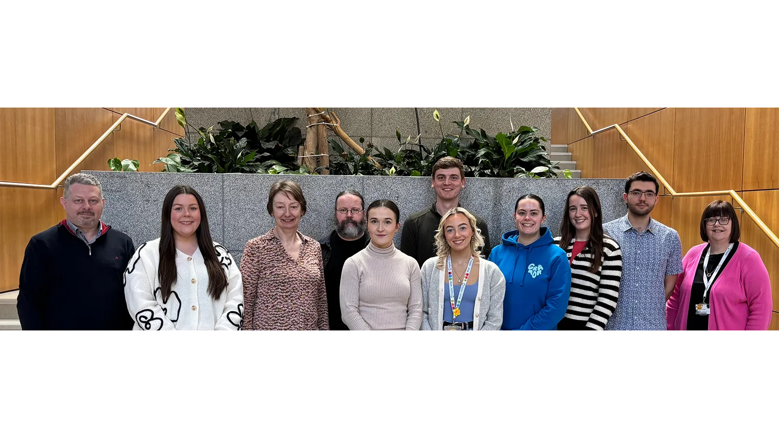 Professor Anita Maguire with a group of people smiling for photo
