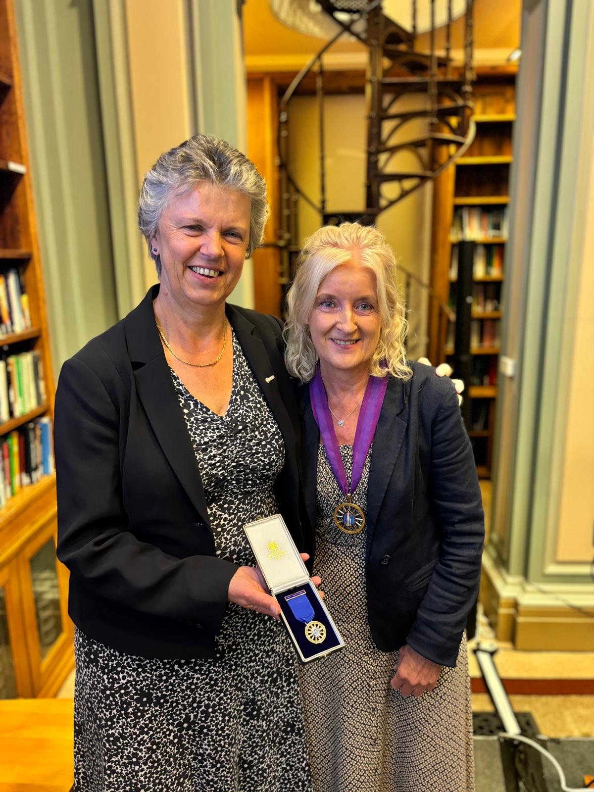 Professor Gill Reid and Dr Annette Doherty stand together smiling in the Library Room at Burlington House Professor Gill Reid and Dr Annette Doherty stand together smiling in the Library Room at Burlington House