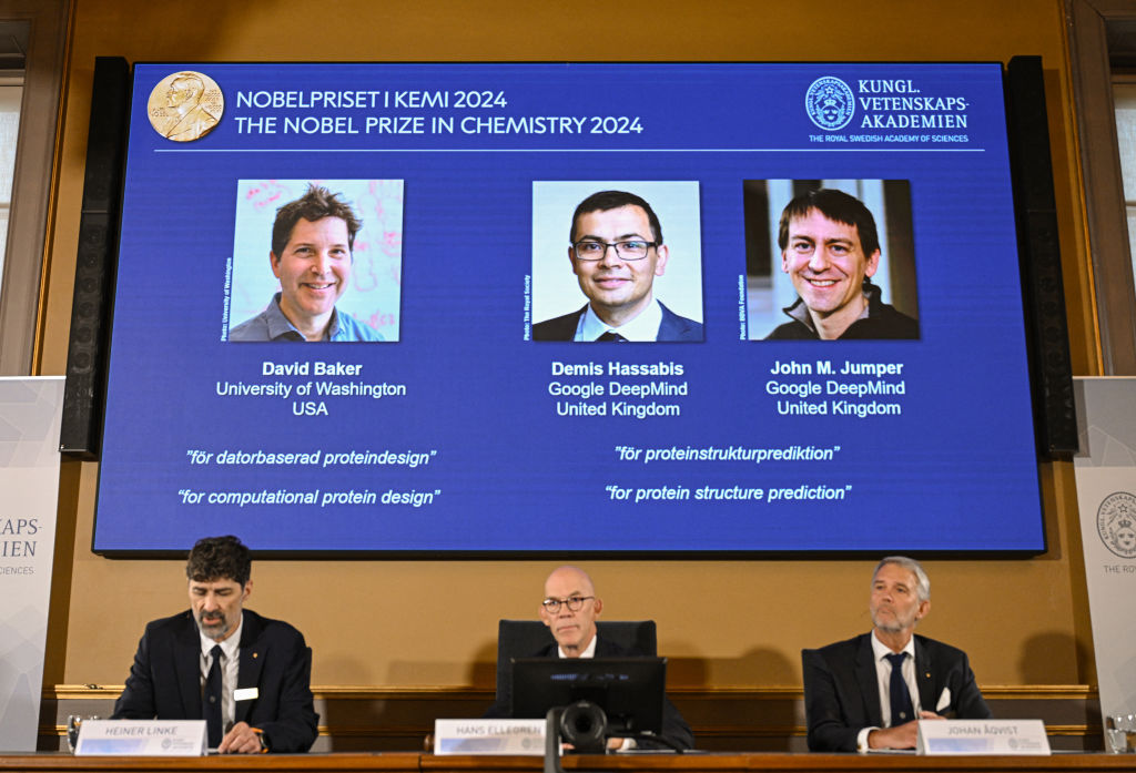(Bottom L-R) Chair of the Nobel Prize Committee for Chemistry Heiner Linke, Secretary General of the Royal Swedish Academy of Sciences Hans Ellegren and Member of the Nobel Prize Committee for Chemistry Johan Aqvist announce the laureates of the 2024 Nobel Prize in Chemistry, (On screen L-R) David Baker, Demis Hassabis and John M Jumper, at the Royal Swedish Academy of Sciences in Stockholm, Sweden on October 9, 2024. The Royal Swedish Academy of Sciences has decided to award the 2024 NobelPrize in Chemistry with one half to David Baker "for computational protein design" and the other half jointly to Demis Hassabis and John M. Jumper "for protein structure prediction." (Bottom L-R) Chair of the Nobel Prize Committee for Chemistry Heiner Linke, Secretary General of the Royal Swedish Academy of Sciences Hans Ellegren and Member of the Nobel Prize Committee for Chemistry Johan Aqvist announce the laureates of the 2024 Nobel Prize in Chemistry, (On screen L-R) David Baker, Demis Hassabis and John M Jumper, at the Royal Swedish Academy of Sciences in Stockholm, Sweden on October 9, 2024. The Royal Swedish Academy of Sciences has decided to award the 2024 NobelPrize in Chemistry with one half to David Baker "for computational protein design" and the other half jointly to Demis Hassabis and John M. Jumper "for protein structure prediction."