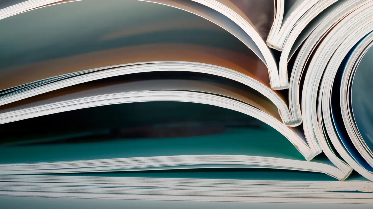 Close up image of open books and magazines