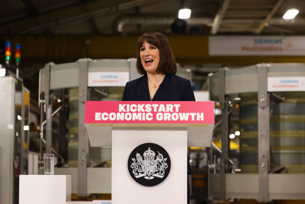 Chancellor of the Exchequer Rachel Reeves MP stands behind a lectern that reads "Kickstart economic growth" in a factory Chancellor of the Exchequer Rachel Reeves MP stands behind a lectern that reads "Kickstart economic growth" in a factory